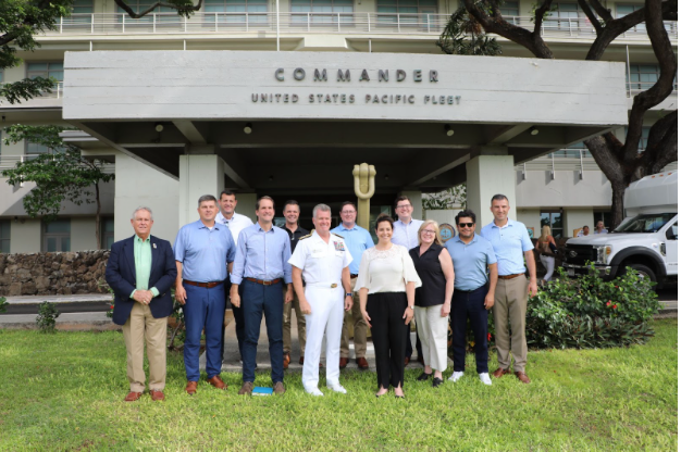 Photo of the delegation with the Commander, U.S. Pacific Fleet following a briefing