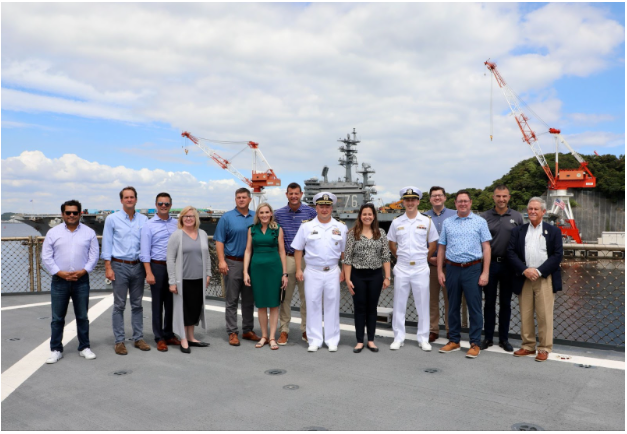 Photo of the delegation aboard the USS Blue Ridge, the flagship of the Pacific Fleet, following a briefing on operations in the region